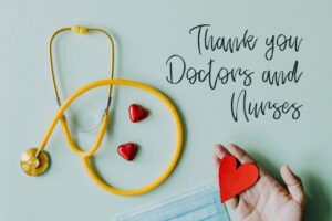 October 2021 - National Healthcare Weeks, thank you doctors and nurses, hand holding a red heart