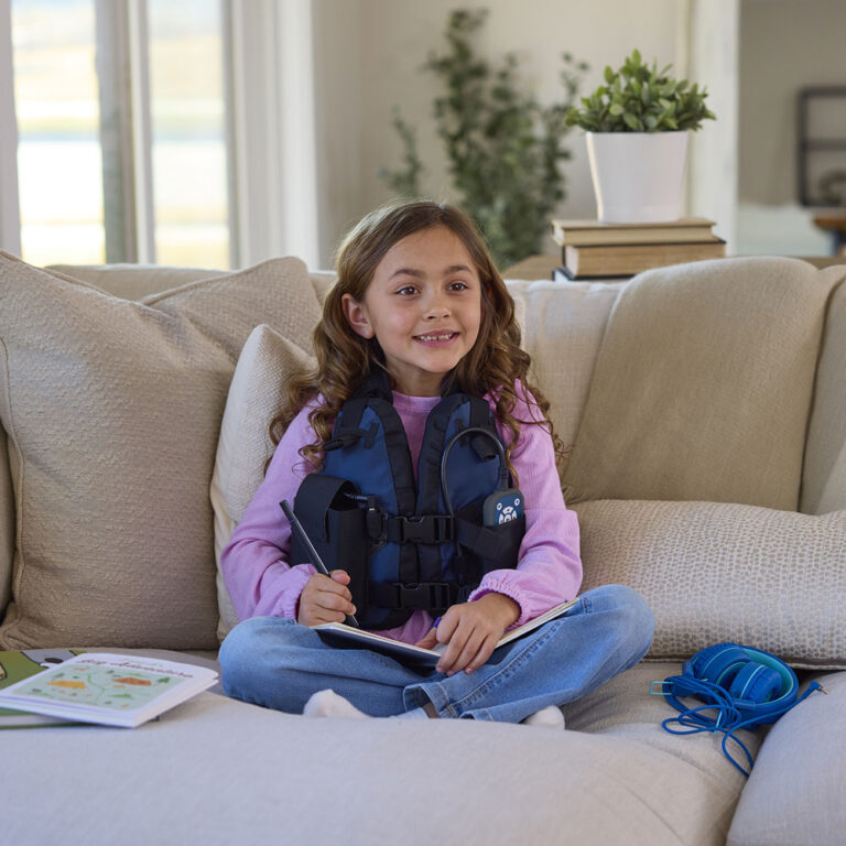 AffloVest lifestyle girl on couch